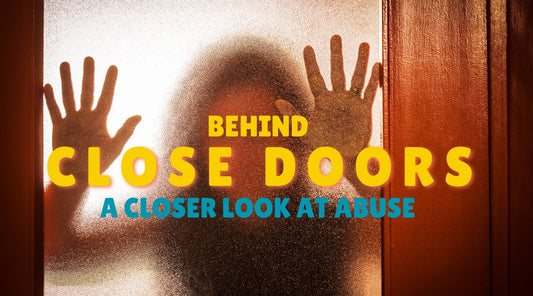A women behind a closed door going through abuse